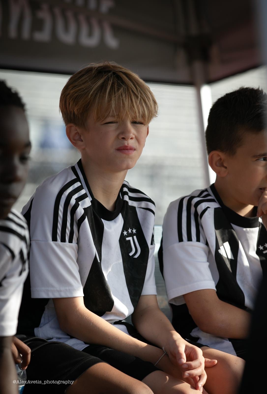 Juventus Academy Phoenix players focused on the bench between matches
